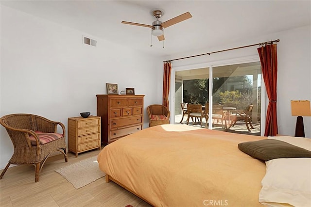 bedroom featuring ceiling fan, access to exterior, and light hardwood / wood-style floors