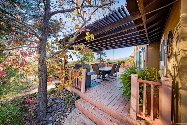 wooden deck featuring a pergola