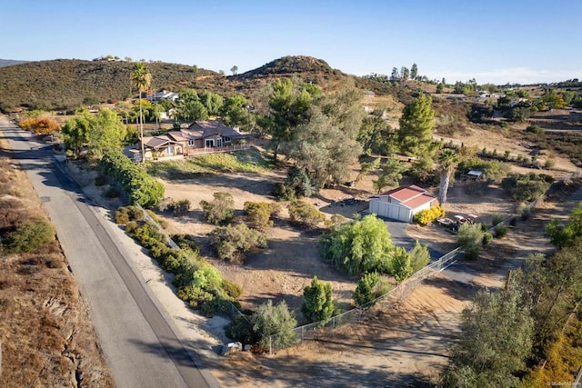 birds eye view of property with a mountain view