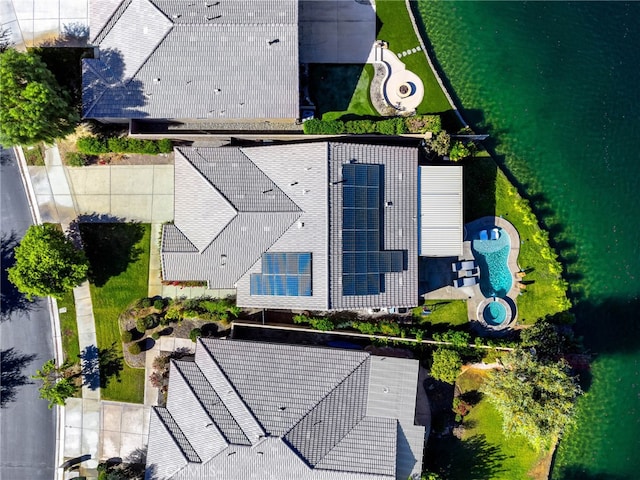 birds eye view of property with a water view