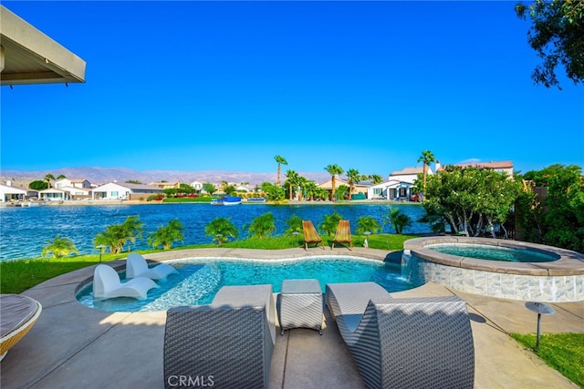 view of swimming pool with a water view and an in ground hot tub