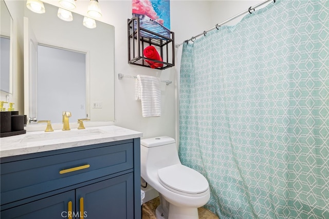 bathroom featuring toilet, a shower with shower curtain, and vanity