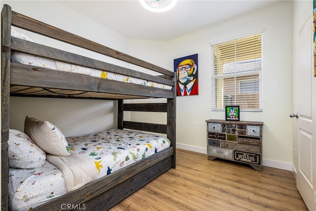 bedroom with wood-type flooring