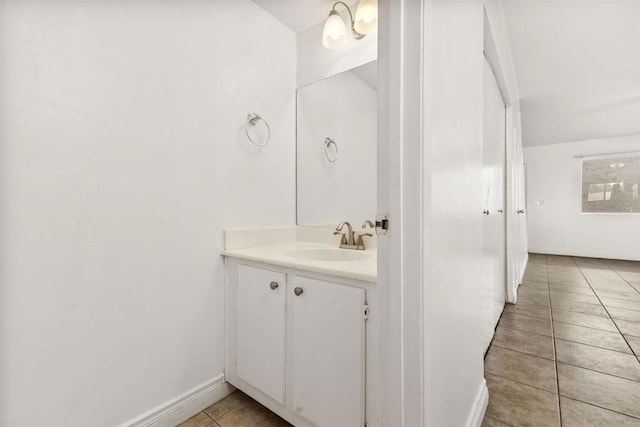 bathroom with tile patterned flooring and vanity