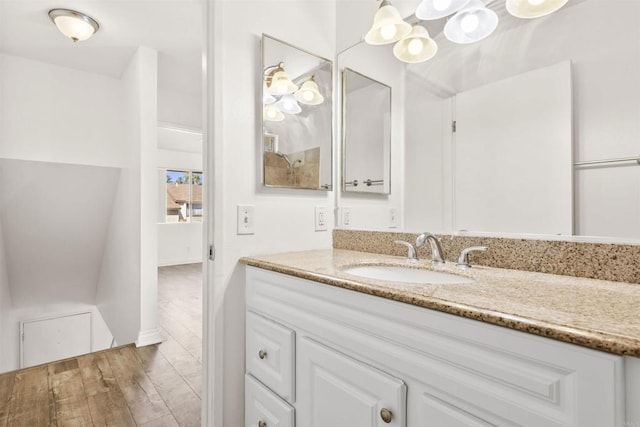 bathroom featuring vanity and hardwood / wood-style flooring