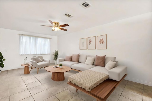 living room with ceiling fan and light tile patterned floors