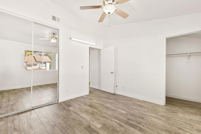 unfurnished bedroom featuring light wood-type flooring and ceiling fan