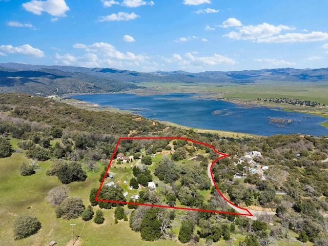 birds eye view of property featuring a water and mountain view