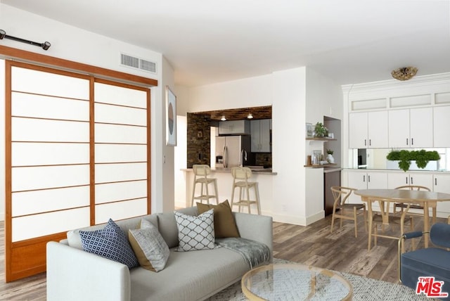 living room featuring dark wood-type flooring