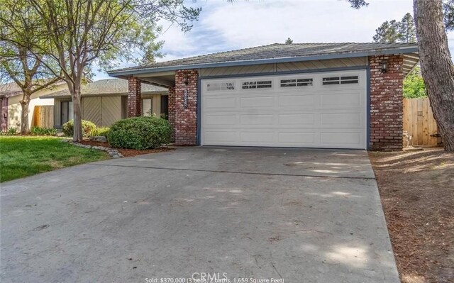 ranch-style house featuring a garage