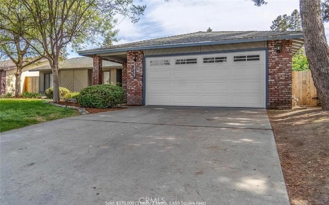 single story home with a garage