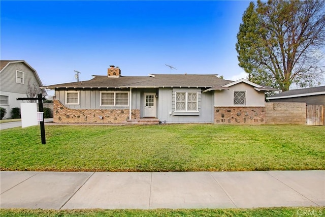 single story home with a front yard