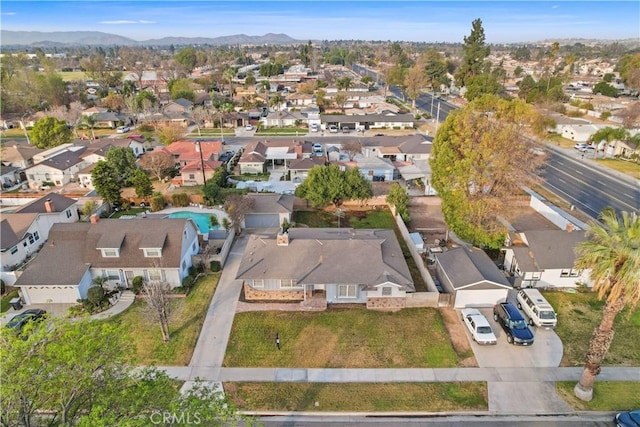 birds eye view of property with a mountain view