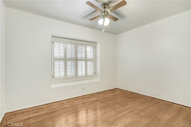 unfurnished room featuring ceiling fan and light hardwood / wood-style flooring