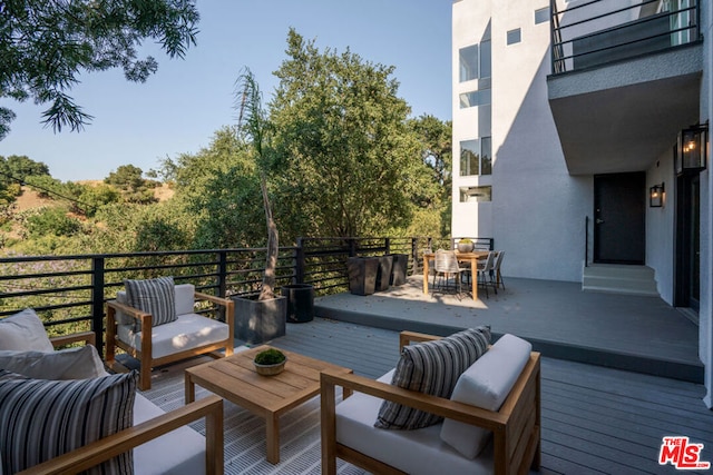 deck with an outdoor hangout area