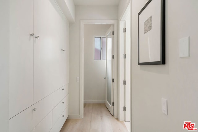 hallway featuring light hardwood / wood-style flooring