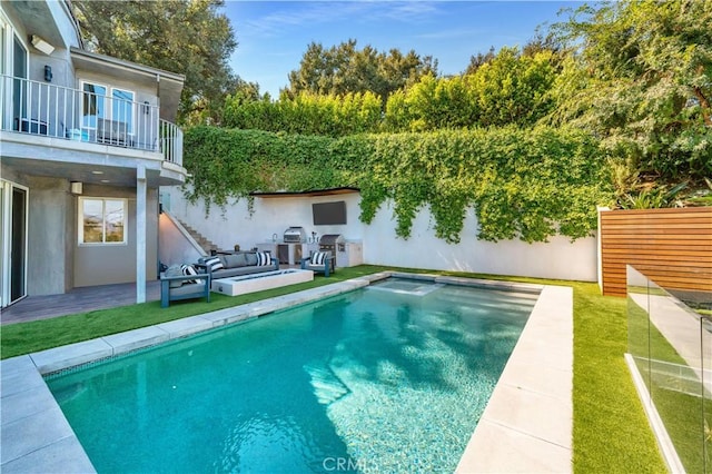 view of swimming pool featuring a lawn, a patio, and outdoor lounge area