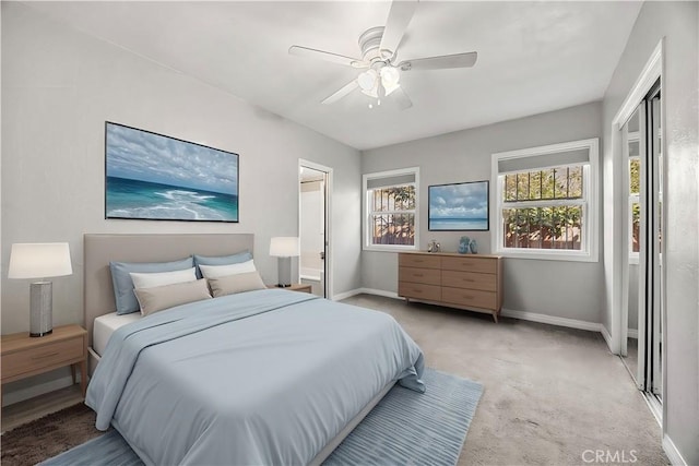 carpeted bedroom featuring ceiling fan