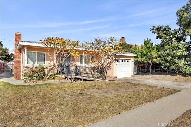 single story home featuring a front yard and a garage