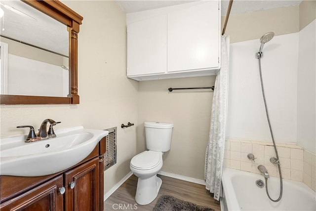 full bathroom with shower / bath combo with shower curtain, toilet, vanity, and hardwood / wood-style flooring