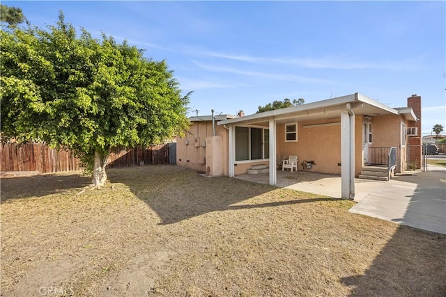 rear view of property with a patio area