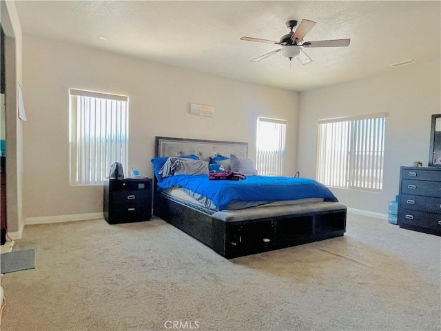 bedroom featuring ceiling fan and carpet flooring