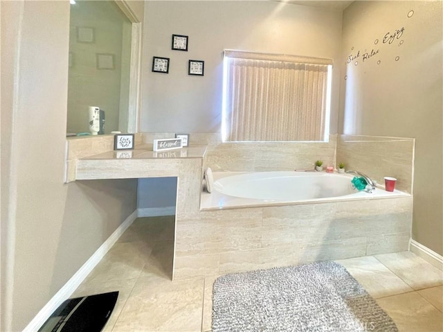 bathroom featuring a relaxing tiled tub and tile patterned flooring