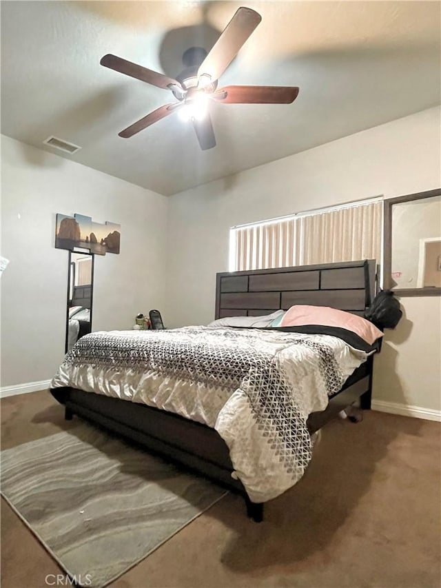 bedroom with ceiling fan and carpet