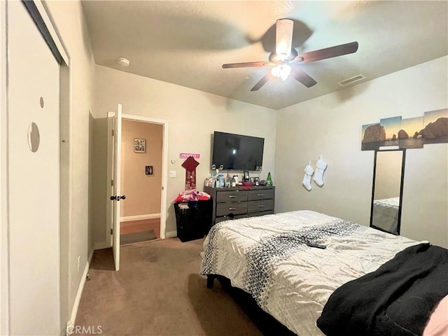 carpeted bedroom with ceiling fan