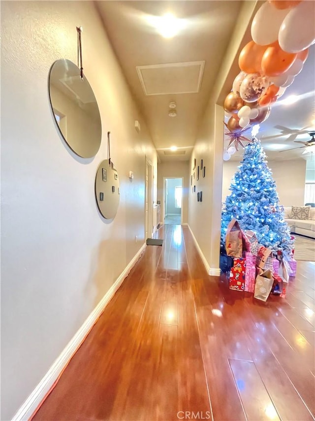 corridor featuring hardwood / wood-style floors