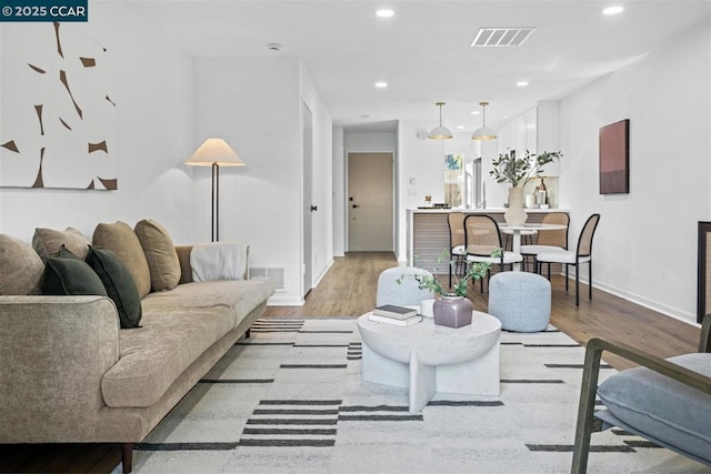 living room with light hardwood / wood-style flooring