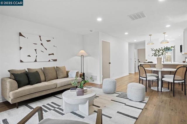 living room with light hardwood / wood-style floors