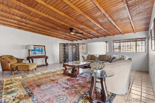 tiled living room with ceiling fan, wooden ceiling, and vaulted ceiling with beams