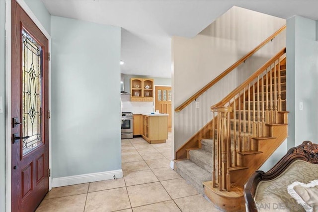 foyer entrance featuring light tile patterned floors