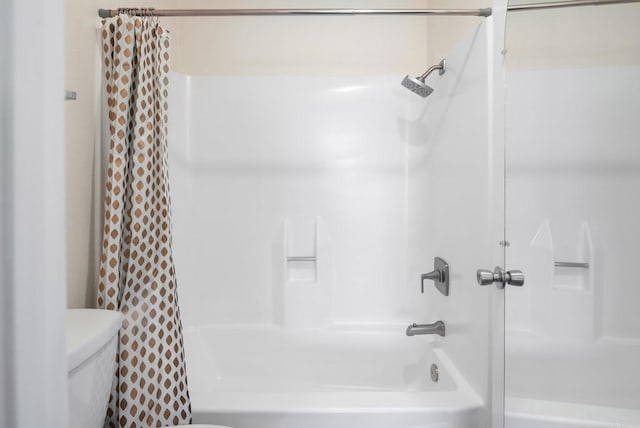 bathroom with toilet and shower / bath combination with curtain