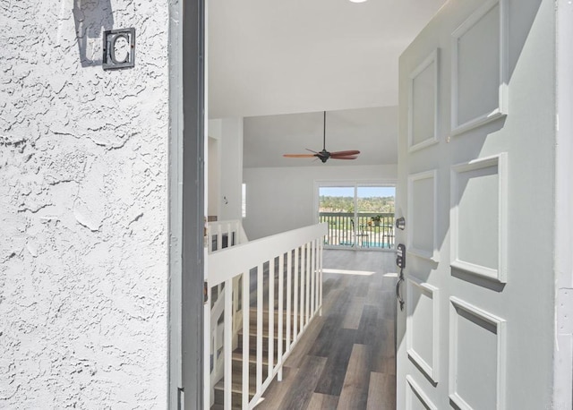 corridor featuring dark wood-style floors