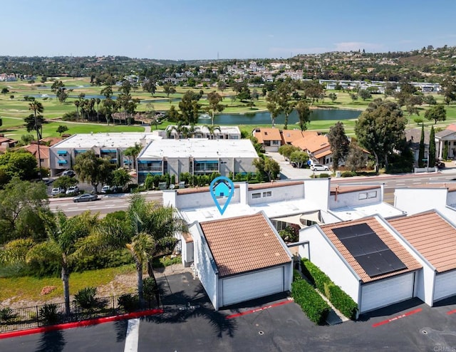 aerial view with view of golf course and a water view