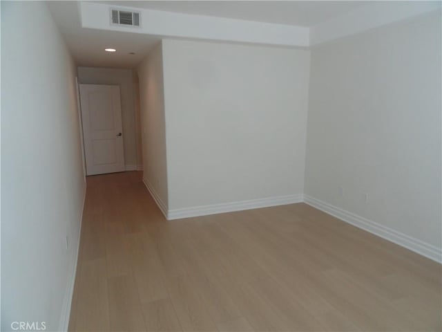 unfurnished room featuring light hardwood / wood-style floors