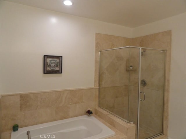 bathroom with independent shower and bath