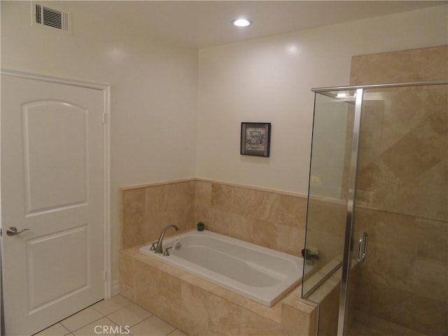 bathroom featuring tile patterned flooring and shower with separate bathtub