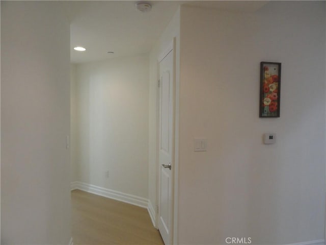 hall with light wood-type flooring