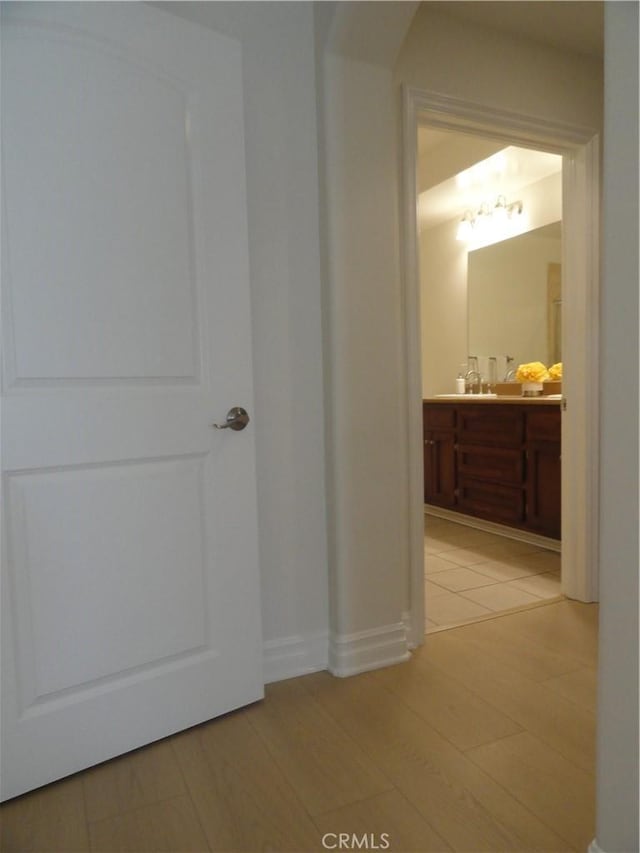 corridor with light tile patterned flooring