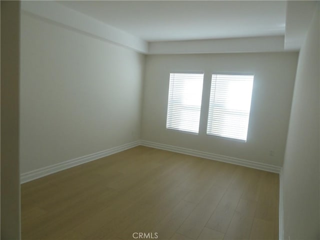 spare room featuring light hardwood / wood-style floors