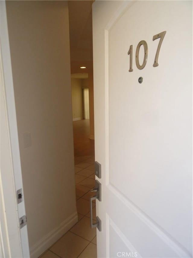 hallway featuring tile patterned floors