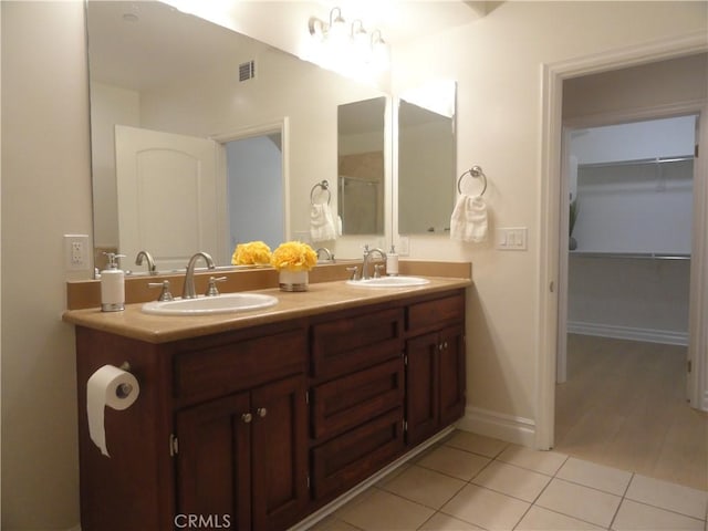 bathroom featuring vanity and tile patterned floors