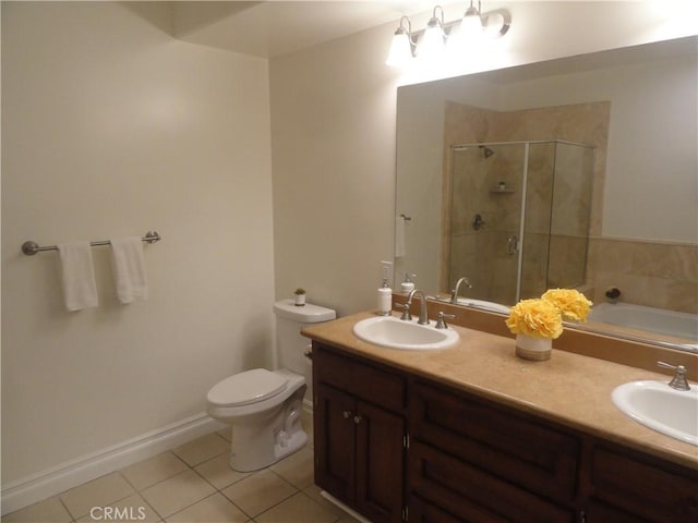 full bathroom with toilet, tile patterned floors, vanity, and independent shower and bath