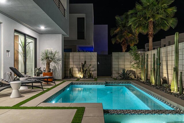 view of swimming pool featuring a patio