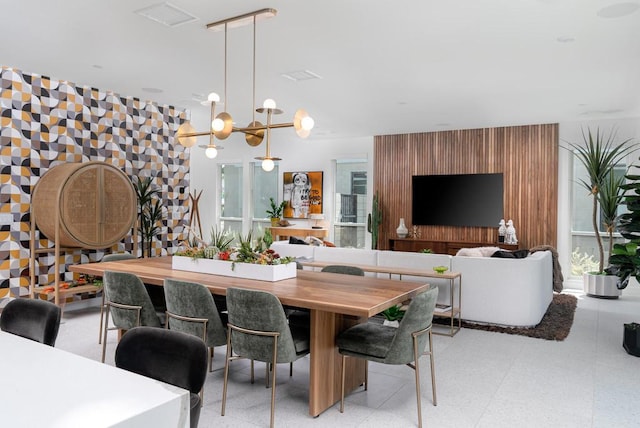 dining area with an inviting chandelier