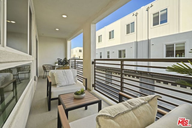 balcony with an outdoor hangout area