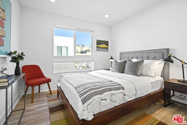 bedroom featuring hardwood / wood-style floors